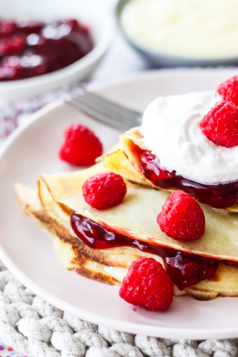 Raspberry Crepes with Vanilla Pudding and Whipped Cream