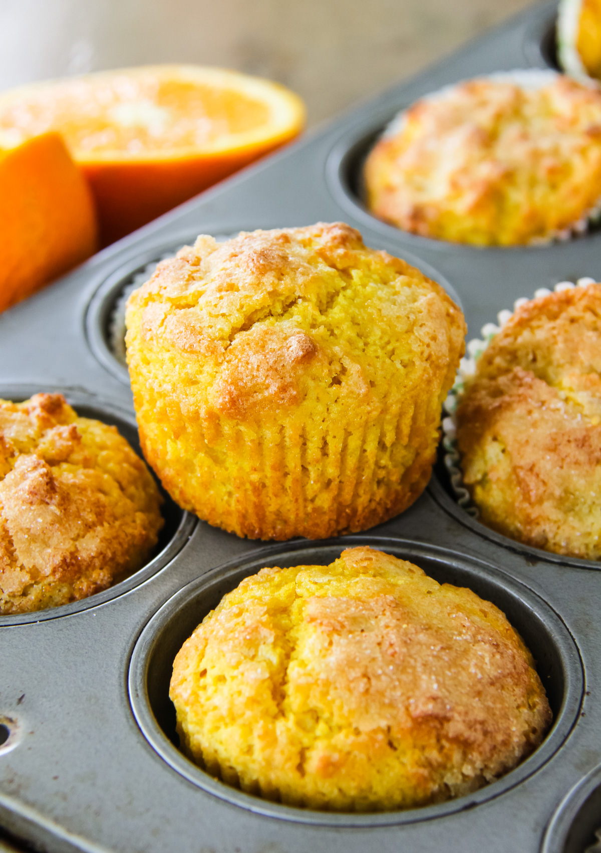 an orange blender muffin sitting on a muffin tray