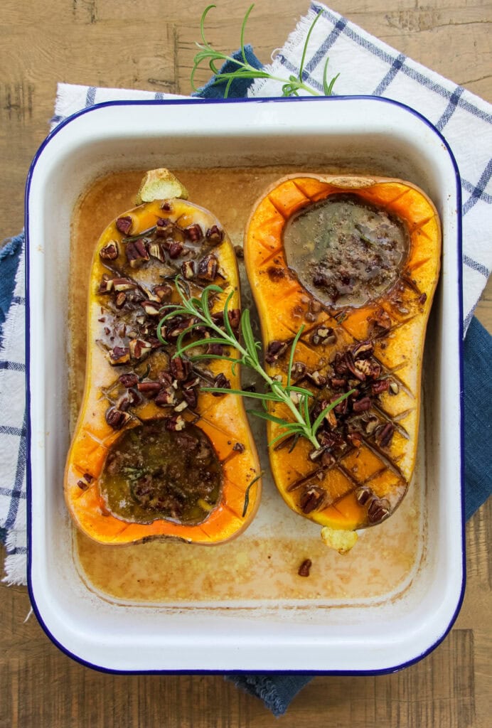 a top down image of two baked honey roasted butternut squash halves