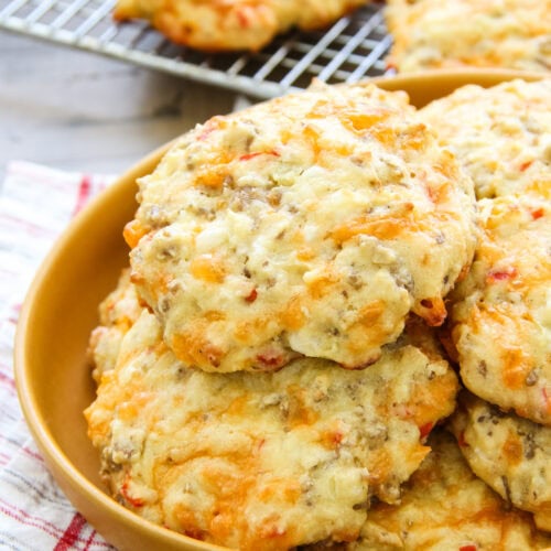 a plate full of sausage breakfast biscuits