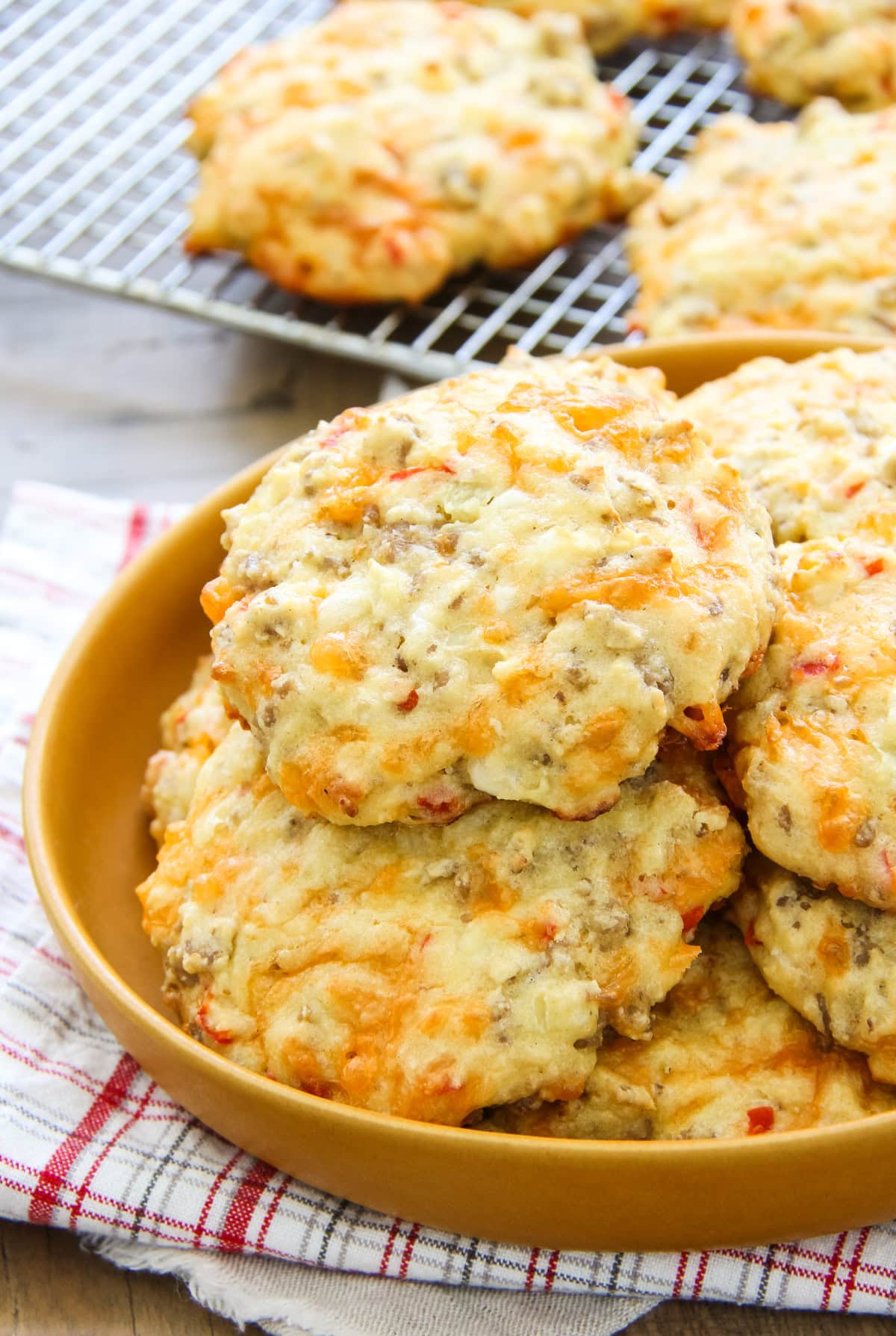 a plate full of sausage breakfast biscuits