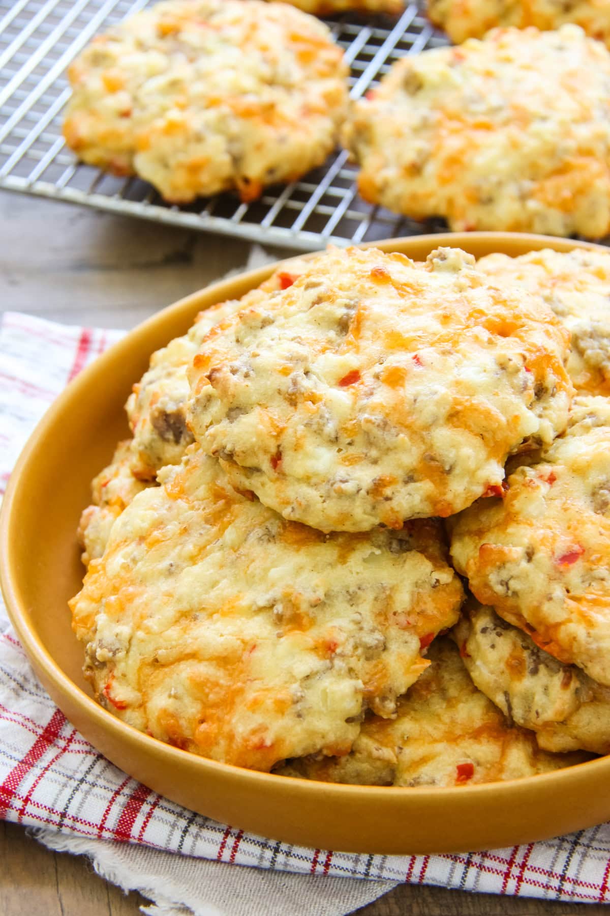 a plate full of sausage breakfast biscuits