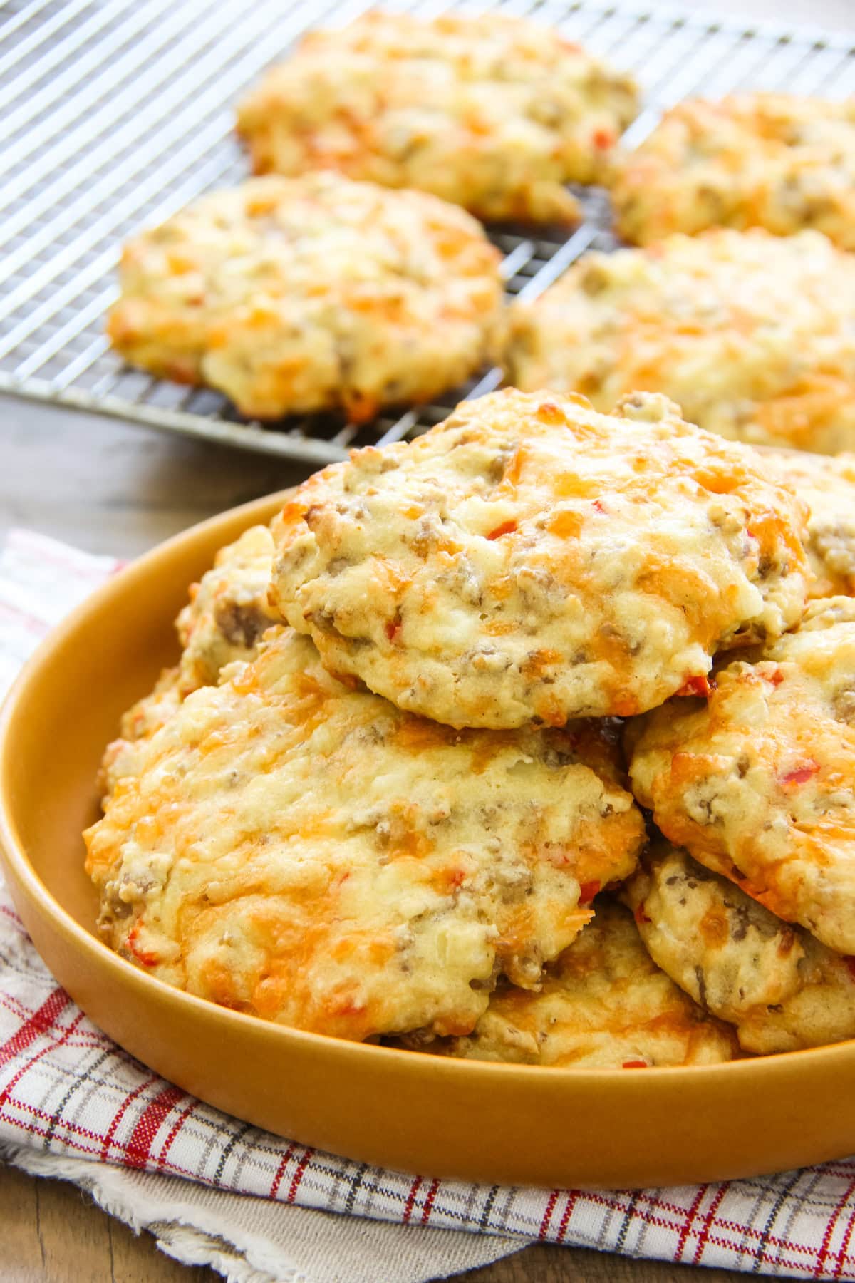 a plate full of sausage breakfast biscuits