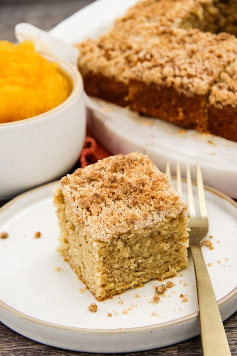 a square of pumpkin spice coffee cake on a plate