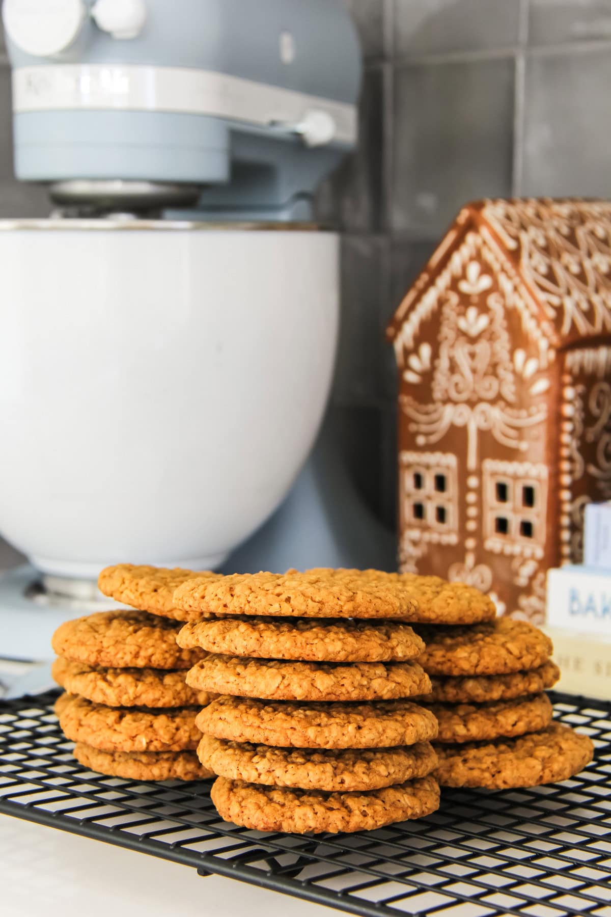 stacks of Chewy Ginger Oatmeal Cookies on a wire baking rack