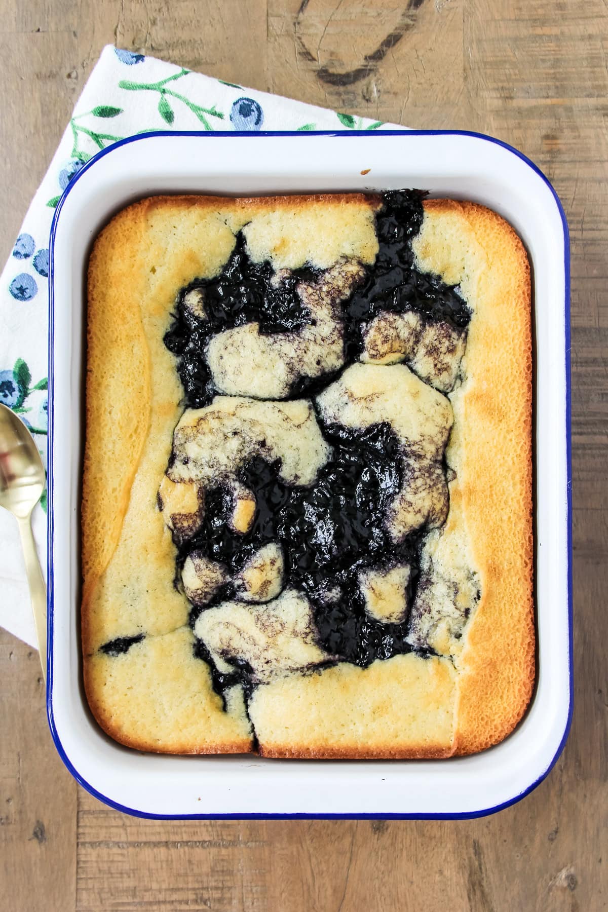 a pan of blueberry pudding cake